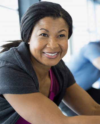 portrait-of-smiling-woman-on-exercise-bike-2026-01-11-08-40-14-utc-2-small