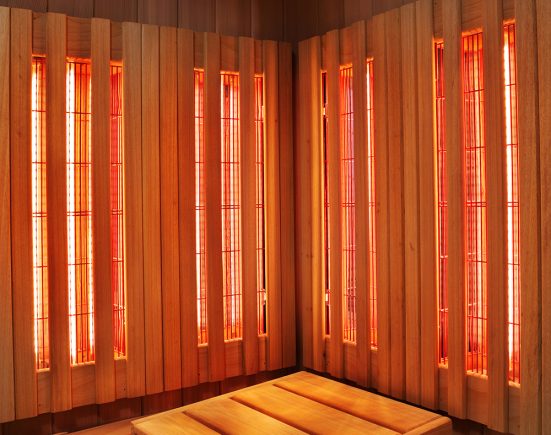 Interior of Finnish sauna, infrared panels for medical procedures, classic wooden sauna